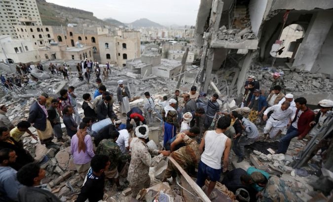 People search under rubble of a house destroyed by a Saudi-led air strike in Sanaa, Yemen August 25, 2017.