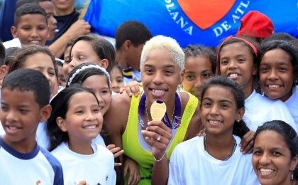 Yulimar Rojas celebrates her gold medla victory in the Women's Triple Jump with kids in Caracas, Venezuela.