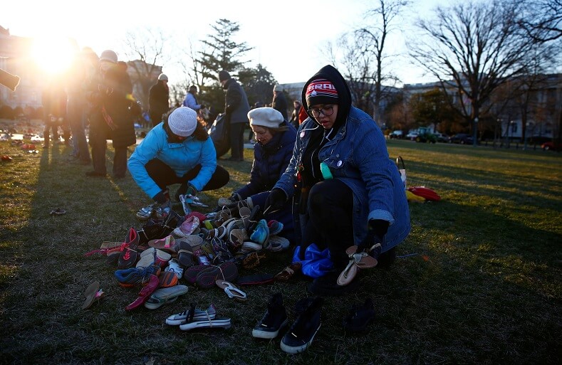 During the early morning volunteers placed children's shoes in front of the U.S. Capitol.