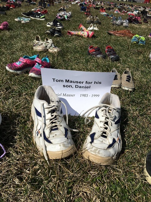 Many donated shoes, including Tom Mauser who lost his son Daniel in the 1999 Columbine shooting. 