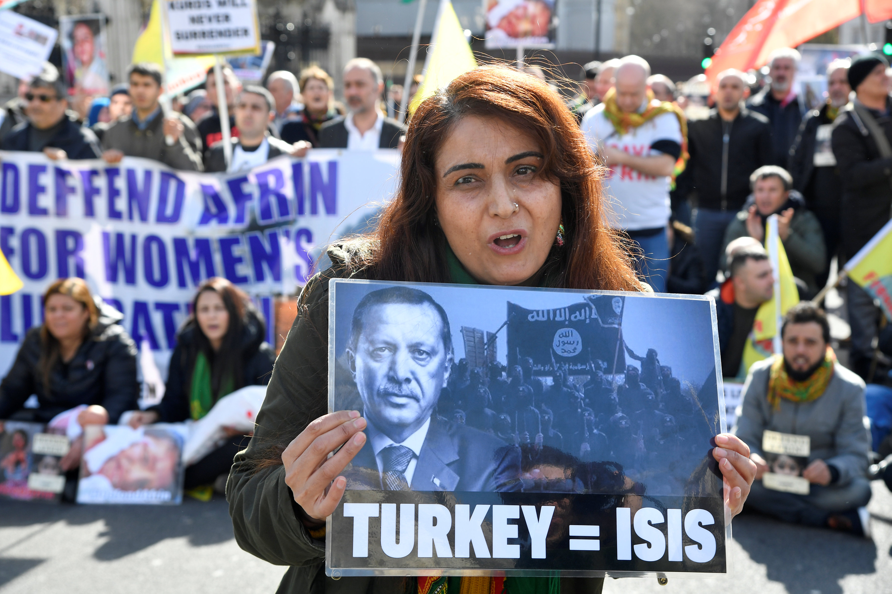 Demonstrators protest against the attack on Afrin, during a march in Westminster, London, Britain March 14, 2018.
