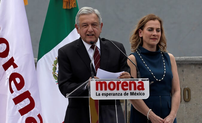 Lopez Obrador, accompanied by his wife, gives a speech after registering his candidacy.