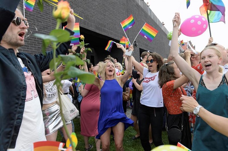 People take part in the fourth edition of the Tricity Equality March, organized by the LGBT community under the slogan 'Together we are stronger and stronger,' in the center of Gdansk, Poland, 26 May 2018.