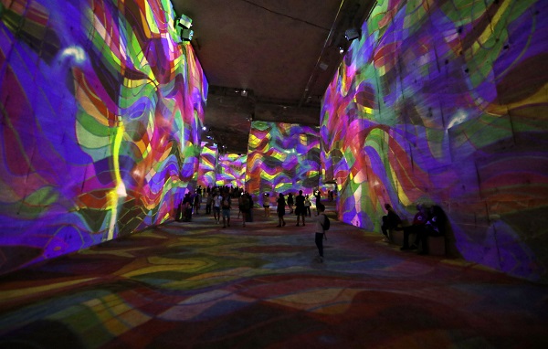 White limestone walls are transformed into multicolored masterpieces lit up by at least 100 projectors.