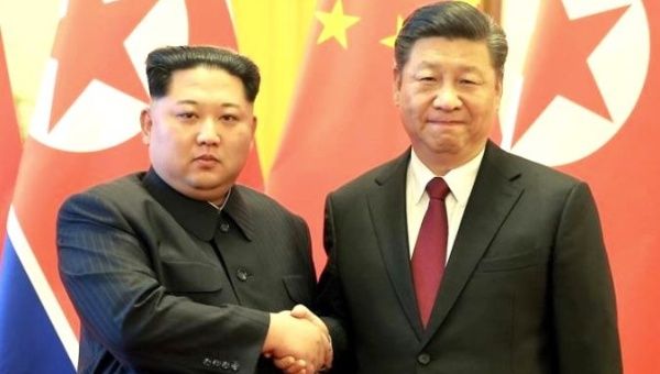 North Korean leader Kim Jong-un (L), pictured with Xi Jinping, will make a three-day China trip.