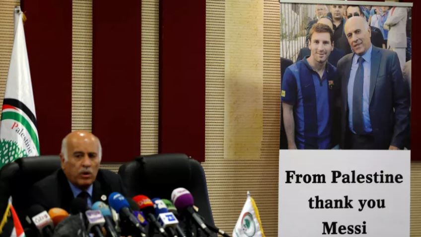 A poster of Palestinian FA chief Jibril Rajoub with Argentina's soccer player Lionel Messi, in Ramallah in the occupied West Bank June 6, 2018.