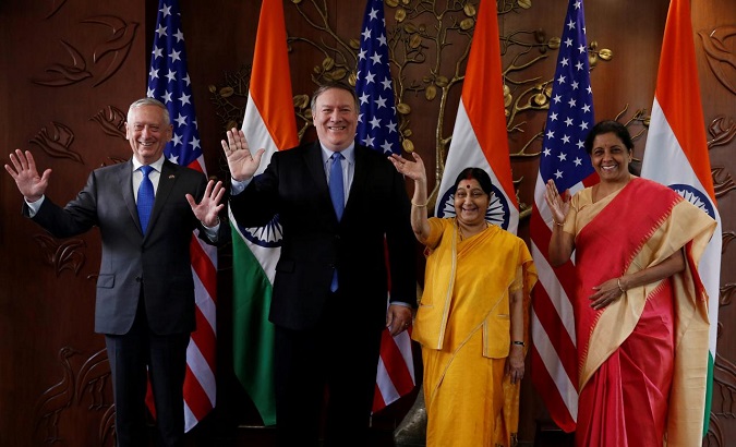 U.S. officials Mike Pompeo and James Mattis pose beside Indian officials Sushma Swaraj and Nirmala Sitharaman before their New Delhi meeting, Sept. 6, 2018.
