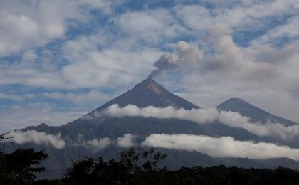 The Fuego volcano spews smoke and ash as seen from San Miguel Los Lotes in Escuintla, Guatemala June 12, 2018.