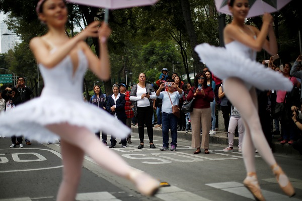 When traffic lights turned red, ballet dancers pirhouetted onto the streets to highlight the city's fine arts scene.