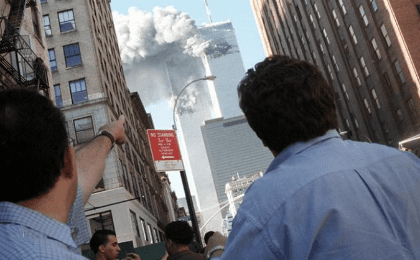 Pedestrians react to the World Trade Center collapse September 11, 2001. 
