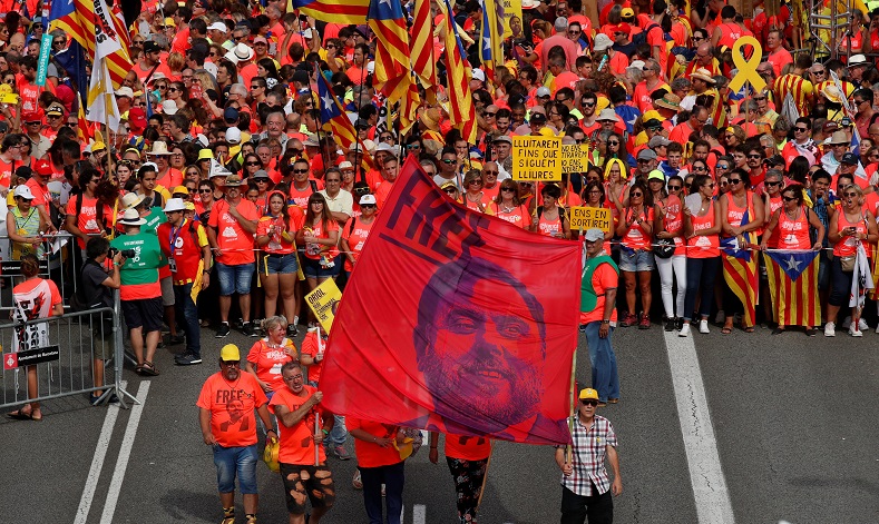 Demonstrators carry an image of Oriol Junqueras, former vice-president of Catalonia who was imprisoned on November 2017 on charges of rebellion.