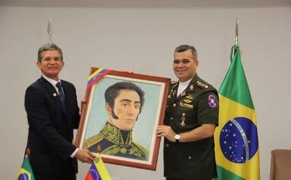 Venezuelan Defense Minister of Venezuela Vladimir Padrino Lopez presents a portrait of Simon Bolivar as a gift to his his Brazilian counterpart Joaquin Silva