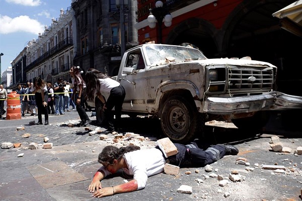 Members of rescue teams, police officers and firefighters take part in a large-scale drill in Puebla, Mexico. 
