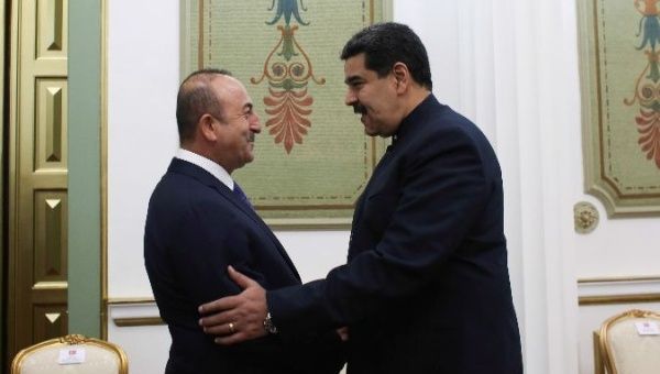 Turkish Foreign Minister Mevlut Cavusoglu meets with Venezuelan President Nicolas Maduro in Caracas.