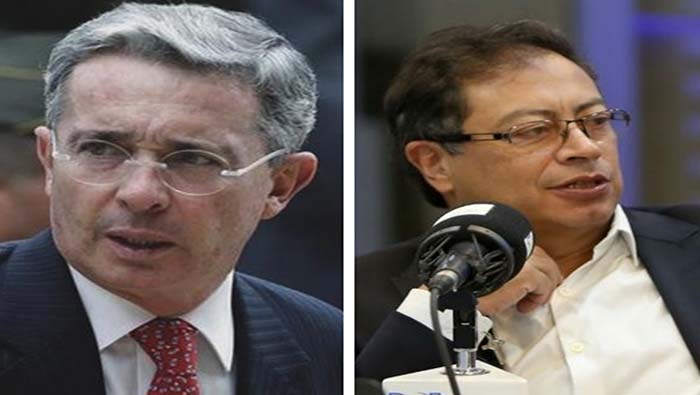 Petro (d) sostuvo que apelaría la decisión judicial  pedir disculpas a Uribe (i).