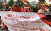 Los manifestantes portaban carteles en apoyo al presidente de Venezuela, Nicolás Maduro.