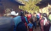 Vecinos de la aldea Palo Verde llegaron a la vivienda donde fueron asesinados a tiros los siete miembros de una familia. 